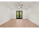 Large bedroom featuring hardwood floors, a ceiling fan, recessed lights and balcony access at 2327 Mason Dr # D23, Atlanta, GA 30316