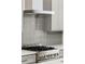 Close up on the gray backsplash behind a stainless range in this modern kitchen at 2327 Mason Dr # D23, Atlanta, GA 30316