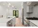 Modern kitchen design with stainless steel appliances, a spacious island, and an exit to the rear at 2327 Mason Dr # D23, Atlanta, GA 30316