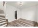 Spacious loft area with contemporary lighting, stairs, and dark door at 2327 Mason Dr # D23, Atlanta, GA 30316