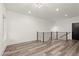 Bright, open loft space with modern railing, hardwood floors, and contemporary lighting at 2327 Mason Dr # D23, Atlanta, GA 30316