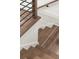 Close up of modern stairs with hardwood steps and metal railing at 2327 Mason Dr # D23, Atlanta, GA 30316
