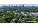 Expansive aerial view showcases lush green surroundings and the Atlanta skyline in the background at 608 Sherwood Ne Rd, Atlanta, GA 30324