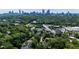 Expansive aerial view showcasing lush green surroundings and the Atlanta skyline in the background at 608 Sherwood Ne Rd, Atlanta, GA 30324