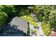 Aerial view of a lush backyard with a dining area and stone pathway at 608 Sherwood Ne Rd, Atlanta, GA 30324