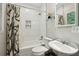 Updated bathroom showcasing new tiling, a modern vanity, and stylish fixtures at 608 Sherwood Ne Rd, Atlanta, GA 30324
