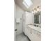 Bright bathroom boasts a marble countertop vanity, modern fixtures, and a skylight for natural light at 608 Sherwood Ne Rd, Atlanta, GA 30324