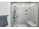 This remodeled bathroom includes a tiled shower with a glass door and modern fixtures at 608 Sherwood Ne Rd, Atlanta, GA 30324