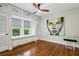 Charming bedroom with a window seat, built-in storage, and hardwood floors at 608 Sherwood Ne Rd, Atlanta, GA 30324