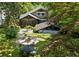 Aerial view of the exterior showcasing the home, carport, and lush backyard at 608 Sherwood Ne Rd, Atlanta, GA 30324