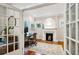 A home office featuring a fireplace, hardwood floors, and natural light streaming through the windows at 608 Sherwood Ne Rd, Atlanta, GA 30324