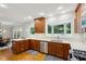 Updated kitchen with wood cabinets, stainless appliances, quartz countertops and adjacent breakfast area at 608 Sherwood Ne Rd, Atlanta, GA 30324