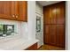 Charming kitchen featuring warm wood cabinets, quartz countertops, and a view to the outdoors at 608 Sherwood Ne Rd, Atlanta, GA 30324