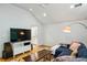 Bright living room with hardwood floors, vaulted ceilings, and a cozy sectional sofa at 608 Sherwood Ne Rd, Atlanta, GA 30324