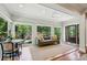 Bright living space with a wall of windows, a comfortable sofa, and a stylish breakfast nook at 608 Sherwood Ne Rd, Atlanta, GA 30324