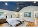 Inviting main bedroom features a cozy seating area, blue accent ceiling, and hardwood floors at 608 Sherwood Ne Rd, Atlanta, GA 30324