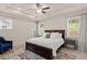 Inviting bedroom with tray ceiling, natural light, soft rug and stylish decor at 6100 Misty Hill Ln, Buford, GA 30518