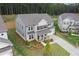 Two-story home boasts a well-manicured lawn, neutral colors, and a classic architectural design at 6100 Misty Hill Ln, Buford, GA 30518