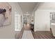 Spacious foyer features hardwood floors, elegant decor, and an inviting transition into the home at 6100 Misty Hill Ln, Buford, GA 30518