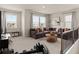 Spacious upstairs living area featuring a sectional couch, desk area and large windows at 6100 Misty Hill Ln, Buford, GA 30518