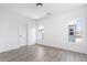 Bright bedroom with two windows and light gray floors showcases a modern and minimalist design at 3319 Stillwood Ln, Hapeville, GA 30354