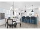 Eat-in kitchen with center island, modern lighting, and breakfast bar seating at 3319 Stillwood Ln, Hapeville, GA 30354