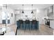 Contemporary kitchen with breakfast bar, sleek countertops, and stainless appliances at 3319 Stillwood Ln, Hapeville, GA 30354