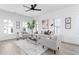 Inviting living room with neutral color scheme, stylish furnishings, and large windows at 3319 Stillwood Ln, Hapeville, GA 30354
