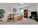 Bright bedroom with daybed, a dark wood bookshelf, and a gray carpet at 4050 Pleasant Woods Dr, Cumming, GA 30028