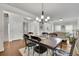 Elegant dining room featuring hardwood floors, neutral paint, and wainscoting at 4050 Pleasant Woods Dr, Cumming, GA 30028