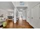 Spacious hallway connecting rooms, with hardwood floors, neutral paint, and bright natural light at 4050 Pleasant Woods Dr, Cumming, GA 30028