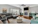 Inviting living room features a brick fireplace, large windows, comfortable seating, and stylish decor at 4050 Pleasant Woods Dr, Cumming, GA 30028
