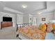 Bright main bedroom showcases tray ceiling, neutral carpet and wooden dresser at 4050 Pleasant Woods Dr, Cumming, GA 30028