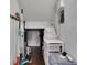 Small storage closet with shelving and space for cleaning supplies and household items at 4050 Pleasant Woods Dr, Cumming, GA 30028
