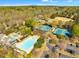 Aerial view of community amenities including a pool, tennis courts, and green spaces at 4525 E Point Dr, Cumming, GA 30041