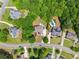 An aerial view shows the house and its surroundings in a neighborhood at 4525 E Point Dr, Cumming, GA 30041