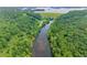 Breathtaking aerial view of the lake and dam surrounded by dense woods at 4525 E Point Dr, Cumming, GA 30041