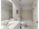 Standard bathroom featuring a shower/tub combination and a mirror over the sink at 4525 E Point Dr, Cumming, GA 30041