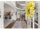 A grand foyer with a view of the staircase, an elegant chandelier, and stylish furnishings at 4525 E Point Dr, Cumming, GA 30041