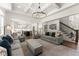 Open-concept living room leads to the kitchen and staircase, providing a spacious and inviting atmosphere at 4525 E Point Dr, Cumming, GA 30041