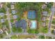 Aerial view of the neighborhood pool, tennis courts, playground, and surrounding well-maintained homes and landscaping at 508 Canton Ct, Canton, GA 30115