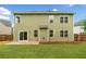 Rear exterior view showing the home's siding, windows, and a small back patio at 508 Canton Ct, Canton, GA 30115