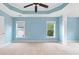 Bedroom with tray ceiling and plush carpet, with a column and natural light at 508 Canton Ct, Canton, GA 30115