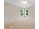 Bedroom featuring carpet, a ceiling fan, and large windows at 508 Canton Ct, Canton, GA 30115