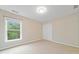 Bright bedroom with large window, carpet, and ample closet space at 508 Canton Ct, Canton, GA 30115