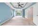 A spacious room with a tray ceiling and carpet flooring with good light and closet access at 508 Canton Ct, Canton, GA 30115