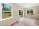 Bright dining area with wood floors and large windows overlooking a private fenced backyard at 508 Canton Ct, Canton, GA 30115