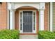 The front door has a striking dark color with white columns and decorative accents at 508 Canton Ct, Canton, GA 30115
