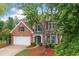 Charming brick-front home with a well-manicured lawn, two-car garage, and mature trees at 508 Canton Ct, Canton, GA 30115