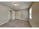 Neutral bedroom with a light and bright aesthetic, complemented by carpet flooring at 1311 Bustling Sw Ln, Marietta, GA 30064